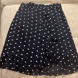 Ladies size 0 Anthropology skirt, navy, polka dots. Ruffle detail new w/tag